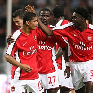Denilson and Kolo Toure celebrate the 3rd Arsenal goal