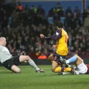 Denilson shoots past Aston Villa goalkeeper Brad Friedel Denilson shoots past Aston Villa goalkeeper Brad Friedel