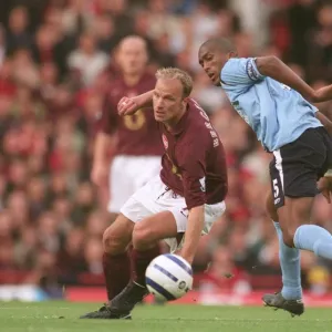 Dennis Bergkamp (Arsenal) Sylvain Distin (Man City)