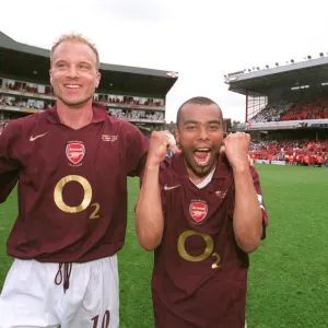 Dennis Bergkamp and Ashley Cole (Arsenal) celebrate at the end of the match