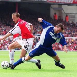 Dennis Bergkamp breaks past Everton defender Alan Stubbs to set up the 2nd Arsenal goal