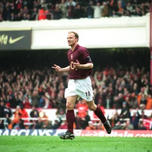 Dennis Bergkamp celebrates scoring the 3rd Arsenal goal