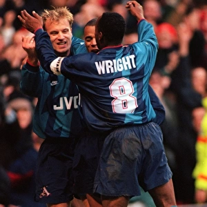Dennis Bergkamp celebrates scoring for Arsenal against Nottingham Forest with Ian Wright and