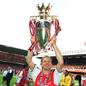 Dennis Bergkamp with the F. A. Barclaycard Premiership Trophy