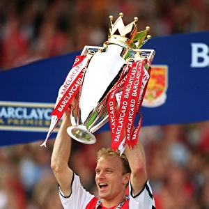 Dennis Bergkamp with the F. A. Barclaycard Premiership Trophy