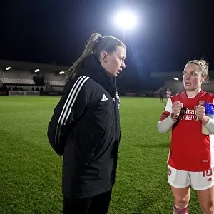 Determined Duo: McCabe and Little's Post-Match Moment at Arsenal Women vs Brighton Hove Albion (2021-22)