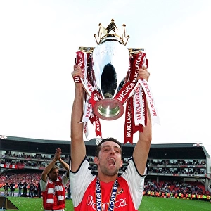 Edu (Arsenal) lifts the F. A. Barclaycard Premiership Trophy