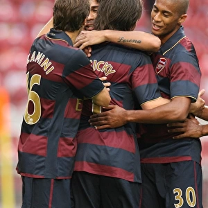 Eduardo celebrates scoring Arsenals 2nd goal with Mathieu Flamini and Armand Traore