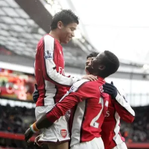 Eduardo, Eboue, and Vela: Triumphant Celebration of Arsenal's 3-0 FA Cup Victory over Burnley Eduardo, Eboue, and Vela: Triumphant Celebration of Arsenal's 3-0 FA Cup Victory over Burnley