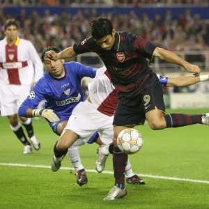 Eduardo shoots past Daniel Alves & Andreas Palop to score the Arsenal goal Eduardo shoots past Daniel Alves & Andreas Palop to score the Arsenal goal