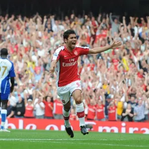 Eduardo's Delight: Emmanuel Eboue Scores Arsenal's Third Goal in 4-0 Victory over Wigan Athletic Eduardo's Delight: Emmanuel Eboue Scores Arsenal's Third Goal in 4-0 Victory over Wigan Athletic