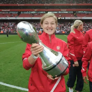 Ellen White's Double Victory: Arsenal's WSL Title Celebration Amidst Premier League Action (2011)