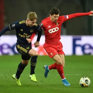 Emile Smith Rowe Clashes with Gojko Cimirot in Arsenal's UEFA Europa League Battle against Standard Liege Emile Smith Rowe Clashes with Gojko Cimirot in Arsenal's UEFA Europa League Battle against Standard Liege