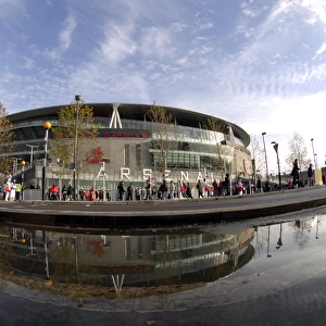 Emirates Stadium reflected in a puddle