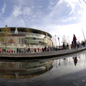 Emirates Stadium reflected in a puddle