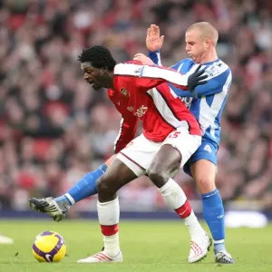 Emmanual Adebayor (Arsenal) Lee Cattermole (Wigan) Emmanual Adebayor (Arsenal) Lee Cattermole (Wigan)