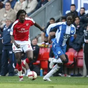 Emmanuel Adebayor (Arsenal) Mario Melchiot (Wigan) Emmanuel Adebayor (Arsenal) Mario Melchiot (Wigan)