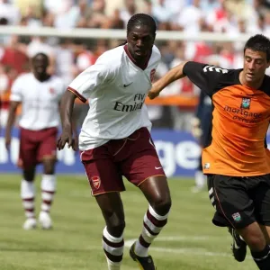Emmanuel Adebayor (Arsenal) Michael Leary (Barnet) Emmanuel Adebayor (Arsenal) Michael Leary (Barnet)