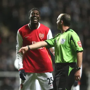 Emmanuel Adebayor (Arsenal) shares a joke with referee Mike Dean
