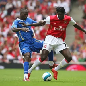 Emmanuel Adebayor (Arsenal) Sulley Muntari (Portsmouth) Emmanuel Adebayor (Arsenal) Sulley Muntari (Portsmouth)