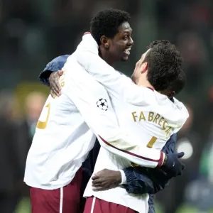 Emmanuel Adebayor celebrates at the final whistle with Cesc Fabregas (Arsenal)