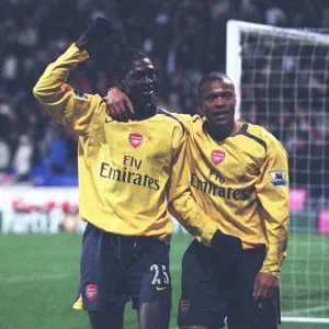 Emmanuel Adebayor celebrates scoring the 3rd goal with Julio Baptista