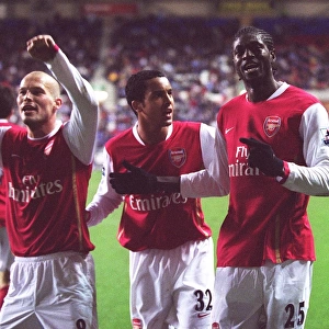Emmanuel Adebayor celebrates scoring Arsenals goal with Theo Walcott