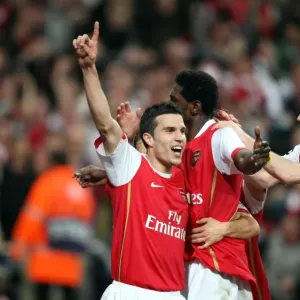 Emmanuel Adebayor celebrates scoring Arsenals goal with Robin van Persie