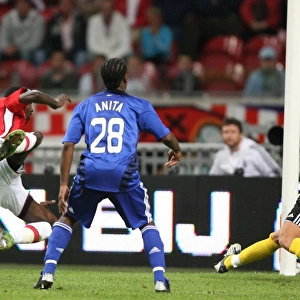 Emmanuel Adebayor heads past Maarten Stekelenburg to