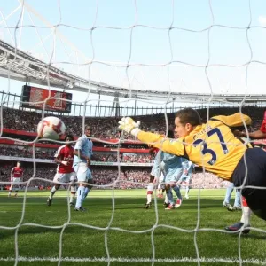 Emmanuel Adebayor heads past Shay Given to score the 1st Arsenal goal Emmanuel Adebayor heads past Shay Given to score the 1st Arsenal goal