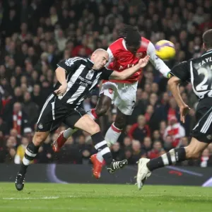 Emmanuel Adebayor heads past Stephen Carr to score the 1st Arsenal goal Emmanuel Adebayor heads past Stephen Carr to score the 1st Arsenal goal