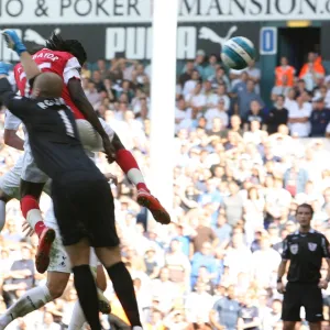 Emmanuel Adebayor heads past Tottenham goalkeeper Paul Robinson to score the 1st Arsenal goal