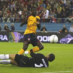 Emmanuel Adebayor shoots past FC Twente goalkeeper