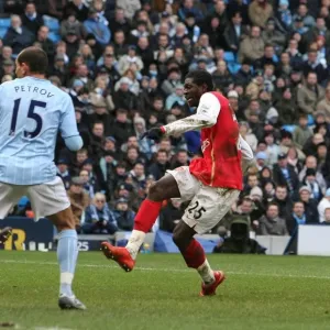 Emmanuel Adebayor shoots past Joe Hart to score his 2nd and Arsenals 3rd goal