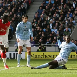 Emmanuel Adebayor shoots past Micah Richards to score the 1st Arsenal goal