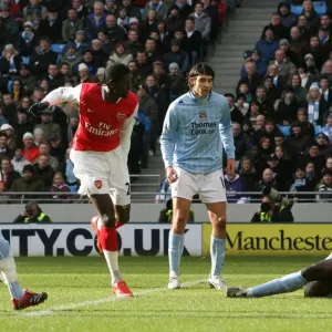 Emmanuel Adebayor shoots past Micah Richards to score the 1st Arsenal goal