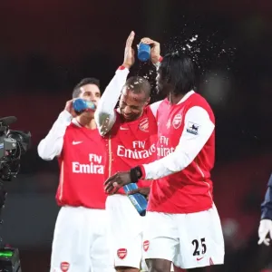 Emmanuel Adebayor Squirts Water at Thierry Henry Print Emmanuel Adebayor Squirts Water at Thierry Henry Print