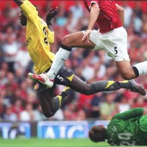 Emmanuel Adebayor is tripped by Manchester United goalkeeper Tomaz Kuszczak for the Arsenal penalty Emmanuel Adebayor is tripped by Manchester United goalkeeper Tomaz Kuszczak for the Arsenal penalty