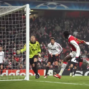 Emmanuel Adebayors header hits the crossbar as AC Milan goalkeeper Zeljko Kalac looks on Emmanuel Adebayors header hits the crossbar as AC Milan goalkeeper Zeljko Kalac looks on
