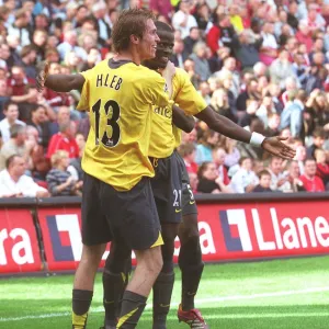 Emmanuel Eboue and Alex Hleb (Arsenal) celebrate the 2nd Robin van Persie goal