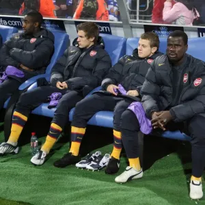 Emmanuel Eboue on the Arsenal bench before the match