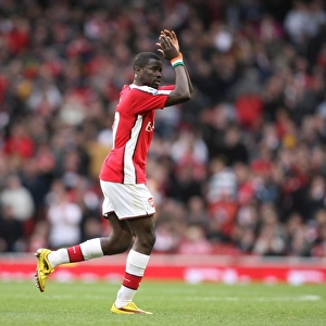 Emmanuel Eboue (Arsenal) claps the fans as he leaves the pitch