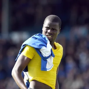 Emmanuel Eboue (Arsenal) gives his boots to a fan after the match