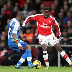 Emmanuel Eboue (Arsenal) Henri Camara (Wigan) Emmanuel Eboue (Arsenal) Henri Camara (Wigan)