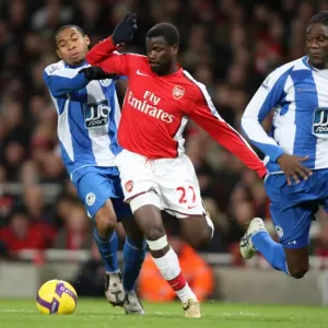 Emmanuel Eboue (Arsenal) Wilson Palacios and Mario Melchiot (Wigan) Emmanuel Eboue (Arsenal) Wilson Palacios and Mario Melchiot (Wigan)