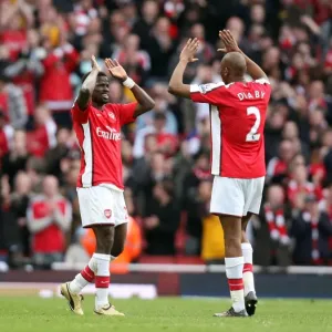 Emmanuel Eboue celebrates at the end of the match with Abou Diaby Emmanuel Eboue celebrates at the end of the match with Abou Diaby