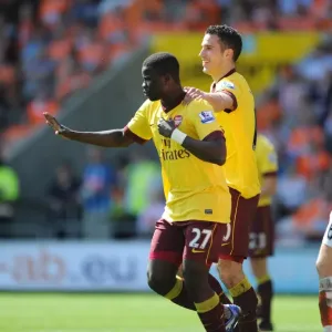 Emmanuel Eboue celebrates scoring the 2nd Arsenal goal with Robin van Persie