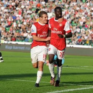 Emmanuel Eboue celebrates scoring the 3rd Arsenal goal with Jack Wilshere