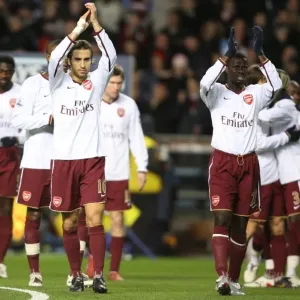 Emmanuel Eboue and Mathieu Flamini applaud the Arsenal fans before the match