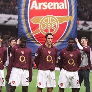 Emmanuel Eboue, Robert Pires and Kolo Toure (Arsenal) line up with an banner behind them